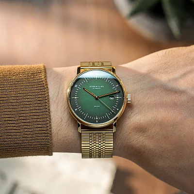 Sternglas Naos Solar Date Green Dial Gold PVD Bracelet S01-NS22-ME09